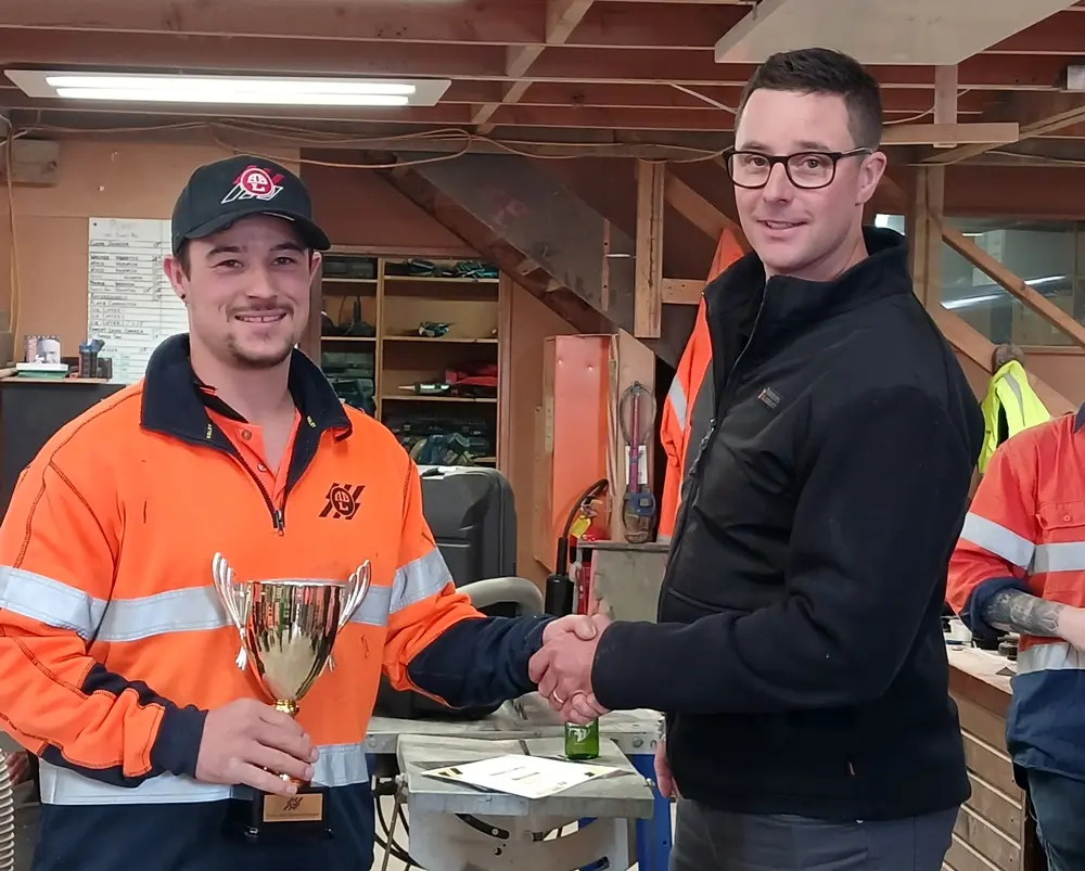 Antony and Hayden presenting the Trevor Hart Memorial Trophy for apprentice of the year 2024